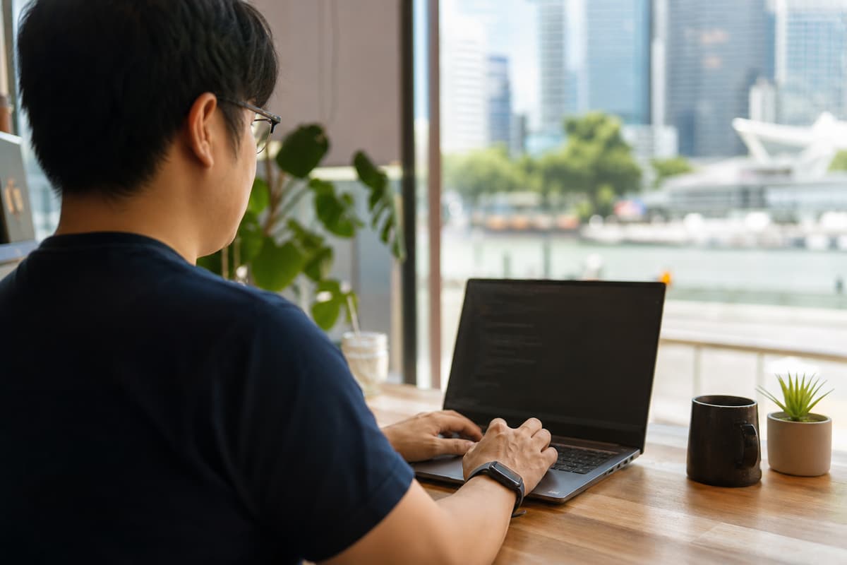 Kevin Myat working at a café in Singapore
